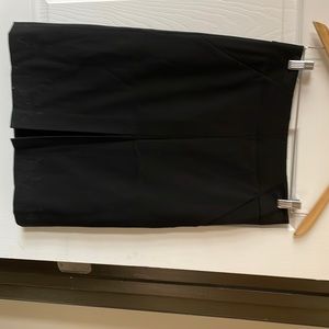 Black a line slash pocket front pleat skirt